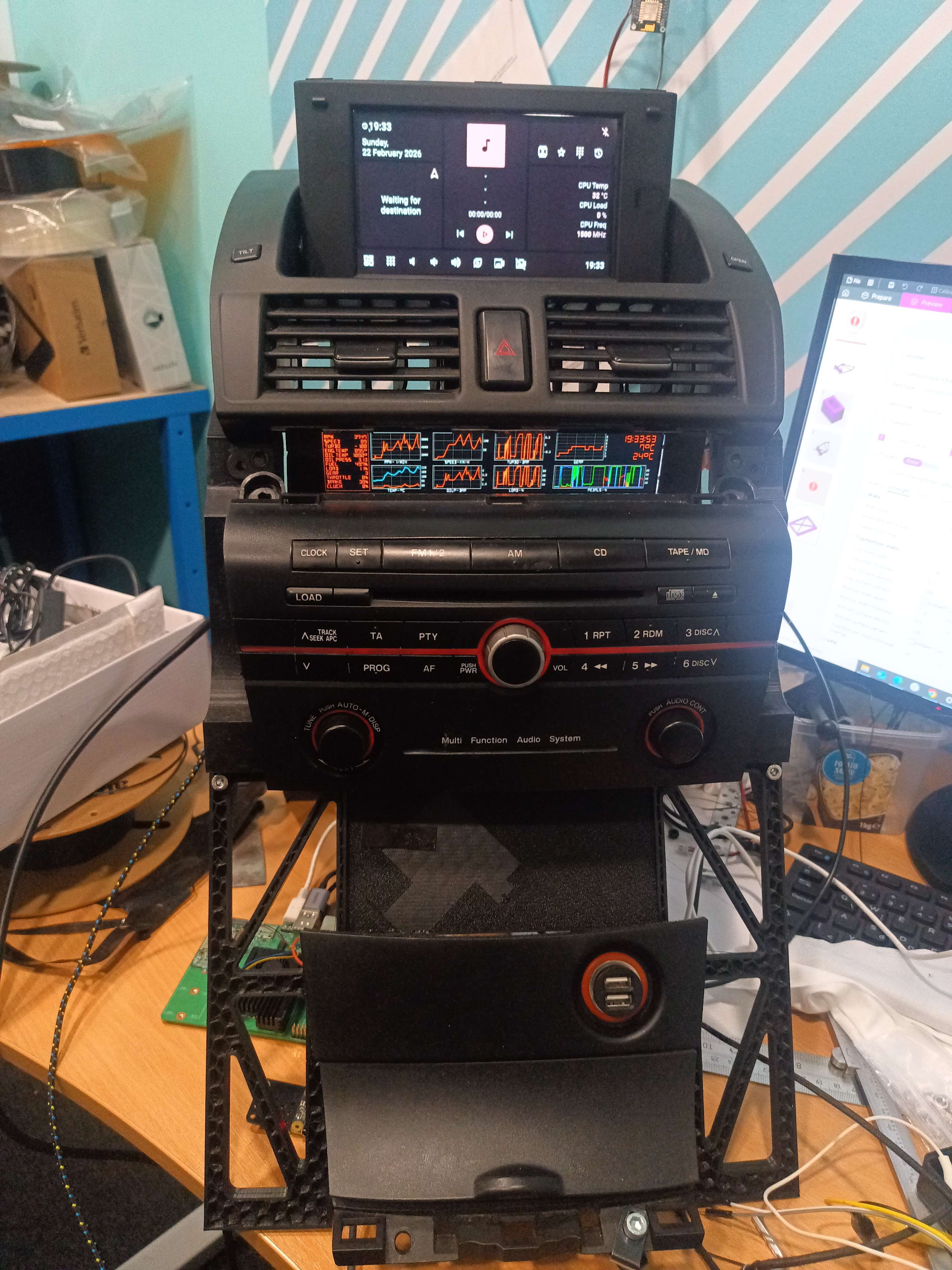 The navi display runs Hudiy and the headunit display shows telemetry, which is provided by Live for Speed and some custom code at the moment, LFS telemetry data is converted to Mazda CAN format and sent to the V-Link OBD adapter, please excuse the mess