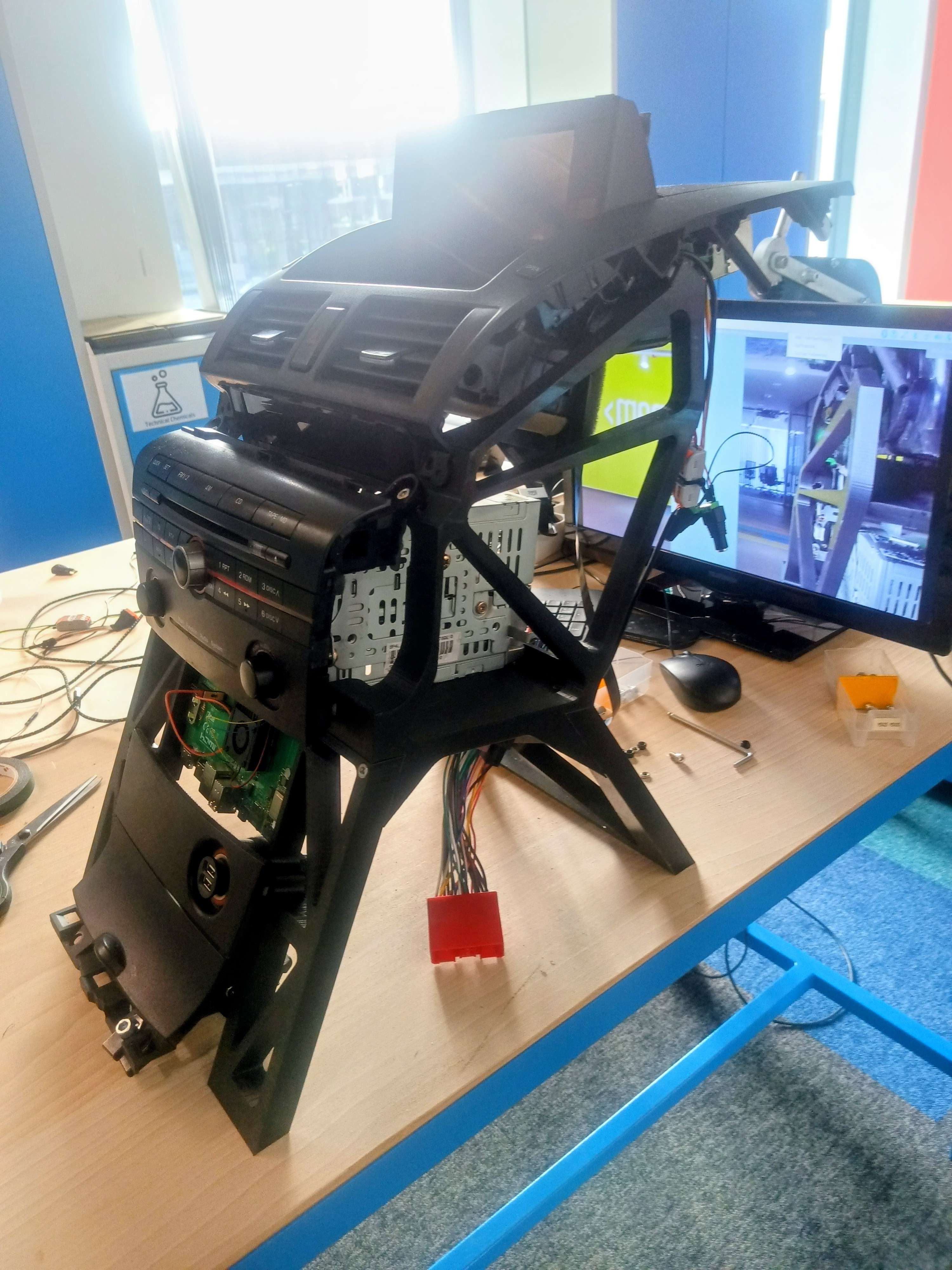 To make testing, development and demonstrations easier, I designed and 3D printed a frame for the whole thing in the same angles as they are in the real car